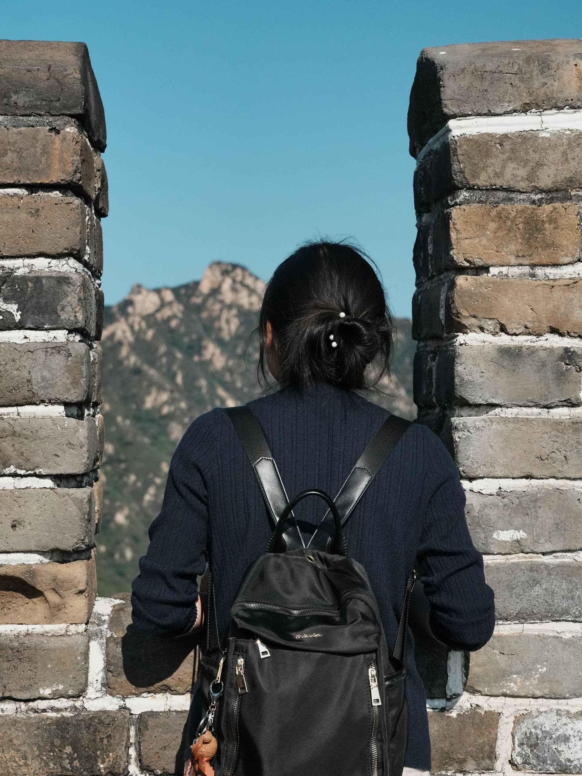 Traveler looking across the Great Wall of China